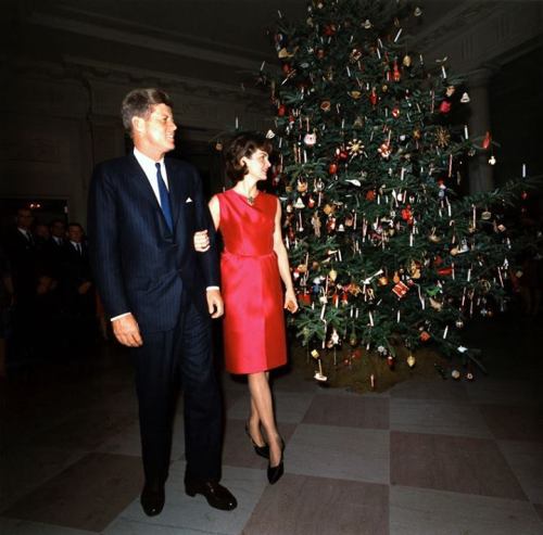 ourpresidents: President and Mrs. Kennedy pose in front of the White House Christmas Tree during the