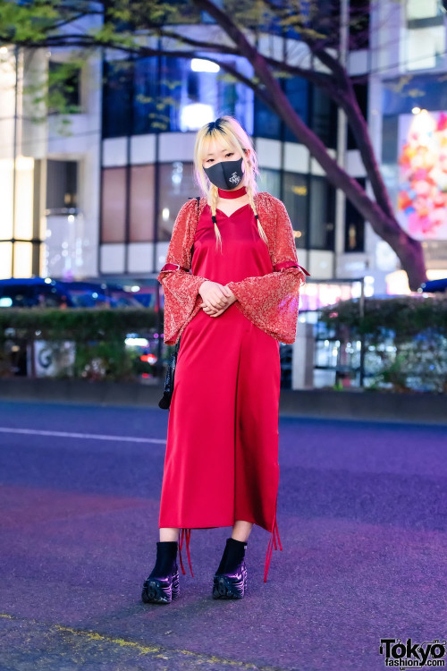 20-year-old Japanese fashion designer Nana Miyashita wearing a buckle-and-flare sleeve dress by her 