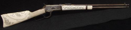 peashooter85:Winchester Model 92 lever action rifle with ornate scrimshaw ivory stock featuring Aust