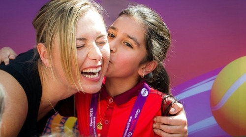 alwayswithsharapova:Maria Sharapova with the kids on meet & greet at Doha, Qatar.