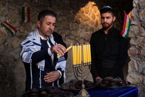 Members of Iraq&rsquo;s Kurdish Jewish community light a menorah on the last night of Hanukkah i