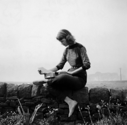 baldespendus:Sylvia Plath with typewriter in Yorkshire, September 1956. Presumably by Ted or Olwyn H