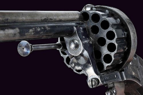 peashooter85:  A rare cased 21 shot folding trigger revolver, France, late 19th century.