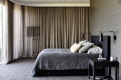{Australian firm Canny Architecture went for a modern barn kind of aesthetic in this home, with dark
