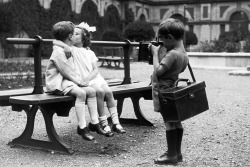 elle-il-eux:  A young photographer capturing a kiss on camera at a children’s party at Alexandra Palace, London, 1926. 