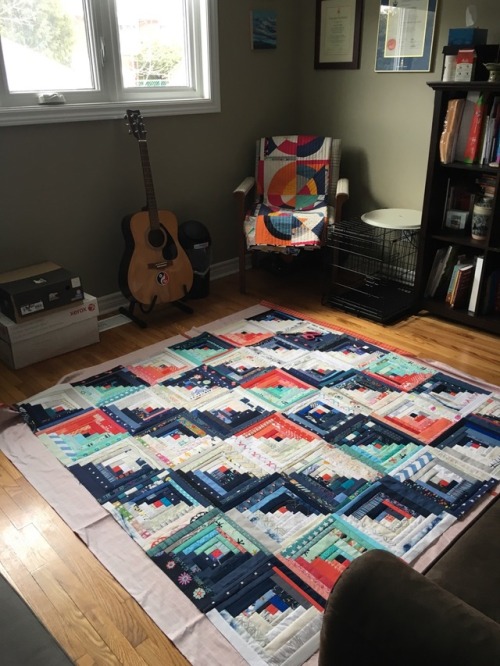 Log cabin quilting: This week, I finished quilting my log cabin scrap quilt. I decided on straight l