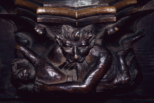 A demon carries off a helpless villager and Woodwose battles a Griffon. Misericords at St Mary &