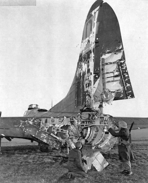 ww1ww2photosfilms:This B-17 returned from a Frankfurt raid. Flak blew rear gunner Roy Urich out and 