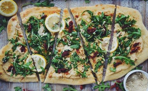 White bean and arugula pizza/flatbread with lemon and sun dried tomato! Hope you all are having a wo