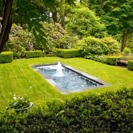 The formal garden&rsquo;s reflecting pool with spouting water is framed by &lsquo;Wintergem&