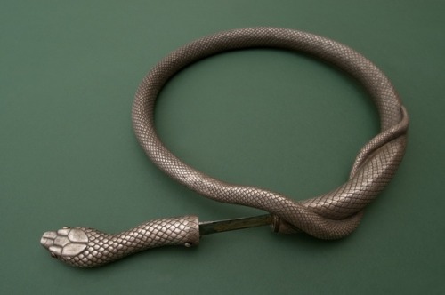 sixpenceee:Silver steel flexible double bladed snake rapier, made during the 19th century in Toledo,