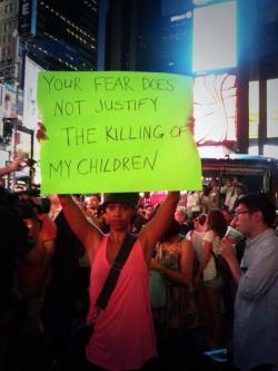 thechanelmuse:  The Trayvon Martin rally in NYC marched 30 blocks to Times Square Thousands have now shut down Time Square staging a massive sit-in. Traffic stopped; no arrests so far. 