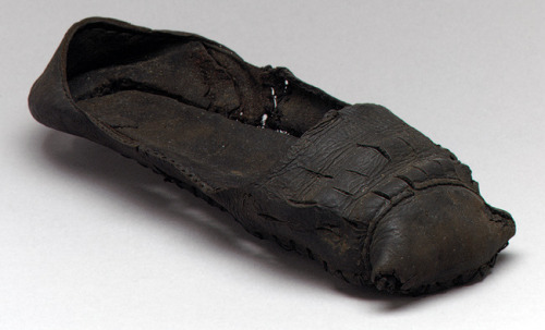 Shoes, 16th century English Black leather These glorious pieces of footwear excavated from an a