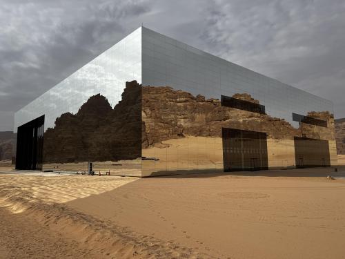 evilbuildingsblog:Dystopian mirrored building in the middle of the desert