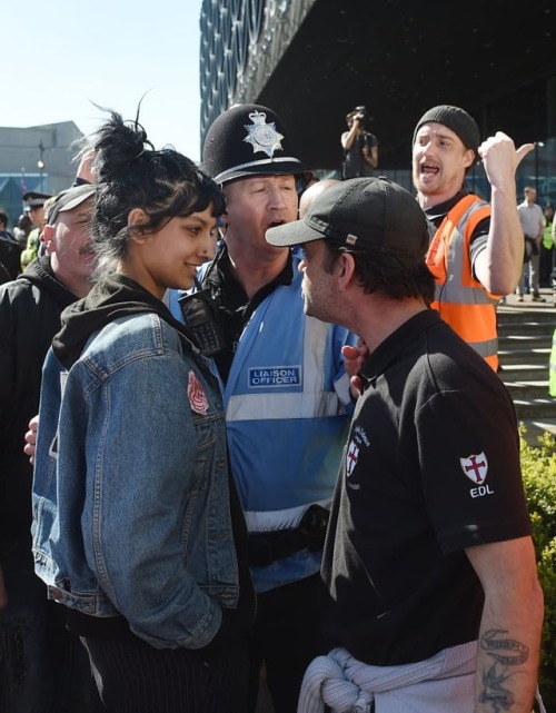 Saffiyah Khan, a Birmingham native of Bosnian–Pakistani descent, stares bemusedly at an enraged memb