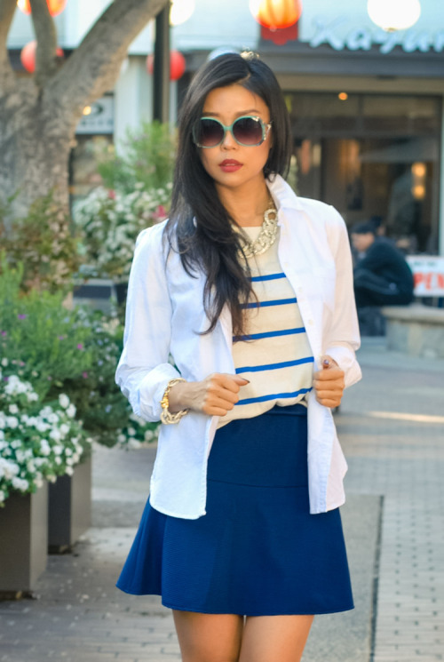 @goodbadfab incorporates the Nautical trend into her look with stripes and navy. Read more here