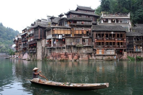 odditiesoflife:  The Ancient Town of Fenghuang, China The town of Fenghuang is located in the Hunan province in China along the banks of the Tuo Jiang River. The town is exceptionally well-preserved and relatively untouched by modern urbanization. The