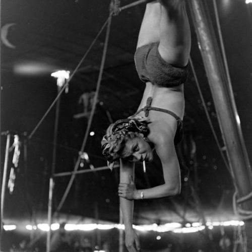 whenthecuriousgirl:Circus girl smokes while rehearsing her stunts: 1949 by Nina Leen
