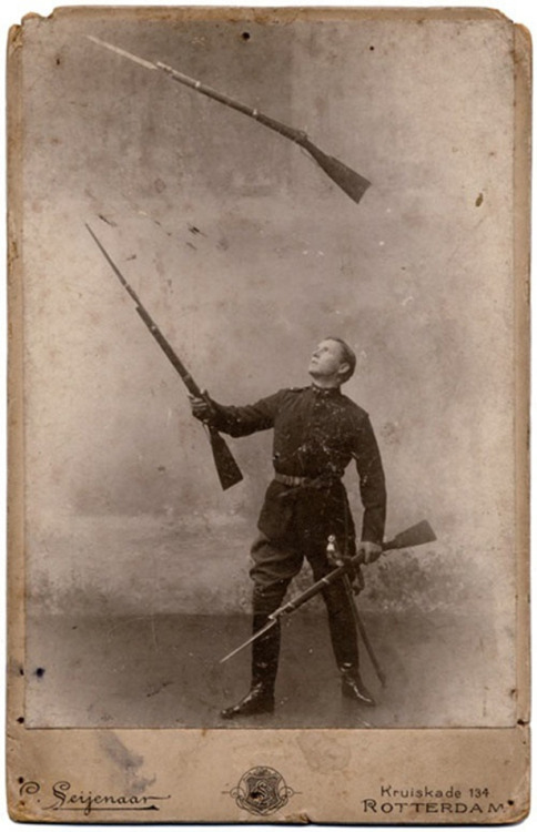 historicaltimes:Famous performer Paul Conchas juggles rifles. He fired these off as he juggled them.