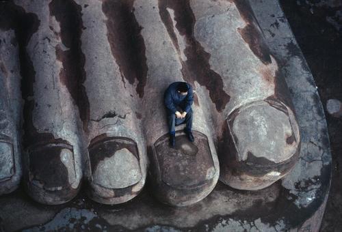 theleoisallinthemind: '80. Sichuan province, China. The foot of an 8th century buddhist statue that stands 72 metres high. Photo by Bruno Barbey.