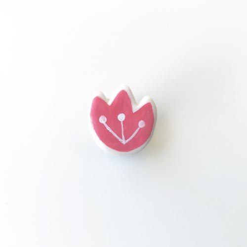 a tiny tulip flower pin, it’s so small you can actually use it as an earring