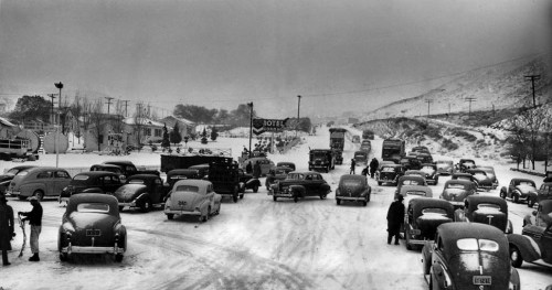 Motor vehicles are halted at Ridge Route l/k/a Interstate 5 by the first major storm of the season. 