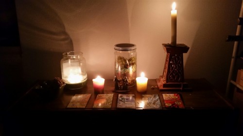 My altar for Imbolc. The cards laid out are the high priestess to represent and welcome Brigid, and 