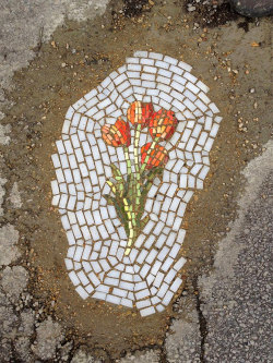  guerrilla artist fills chicago potholes with flower mosaics 