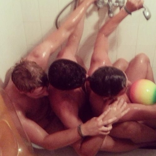 Love sharing a bath. Better with 3.  The guy in middle can feel the dick of his mate behind him, whi