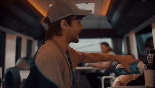 Louis Putting Milk In His Coffee Then Putting The Milk Back In The Fridge On The Tour Bus - X