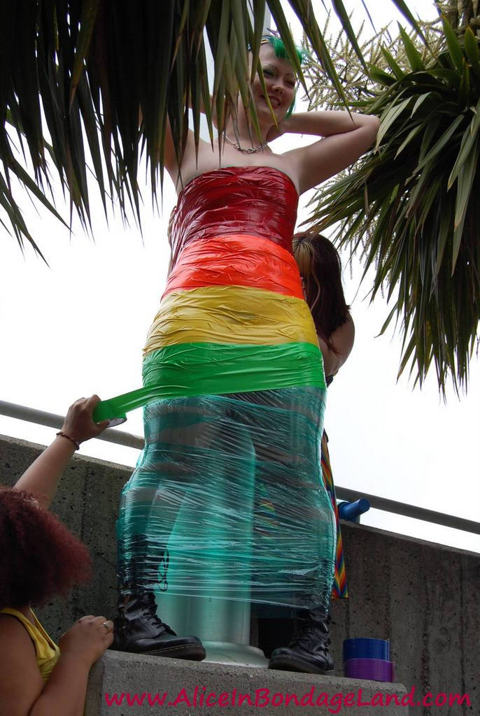 Pride Flag public humiliation bondage with Denali Winter in the Castro neighborhood
