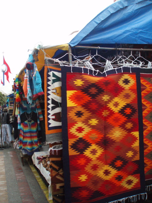 Alfombras y chaquetas, mercado del sábado, Otavalo, Ecuador, 2008.I have a very limited knowledge of