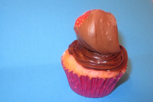 butter pecan cupcake with brown sugar pecans and a chocolate covered strawberry cupcake 