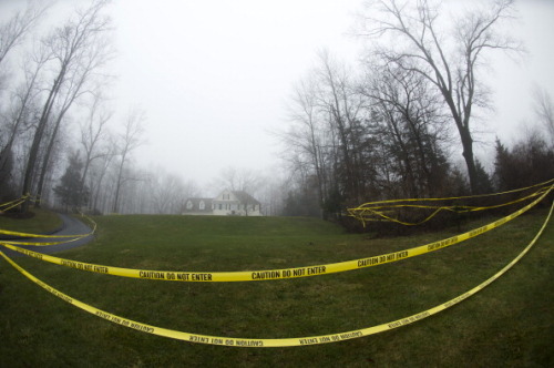 dichotomized:  Crime scene tape hangs outside the home of Nancy Lanza December 18, 2012 in Newtown, Connecticut. Nancy Lanza was killed by her son Adam Lanza before going on his rampage at Sandy Hook Elementary School. 