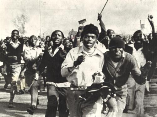 1976: Students in Soweto, South Africa protest being educated in Afrikaans. The South African police
