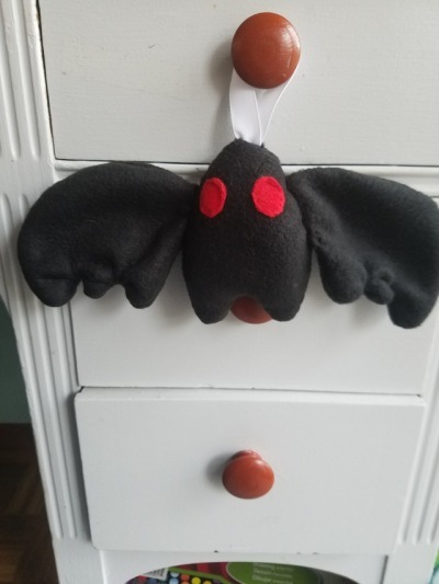 olliedinsmore:  This charming, hand sewn Mothman ornament can now be found at my
