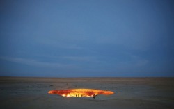 fyeahscienceteachers: shychemist:  gnossienne:  Forty years ago, a vast molten cavity known as the Darvaza crater – nicknamed the “door to hell” – opened up in the desert of north Turkmenistan, and has been burning ever since. Now, Canadian explorer