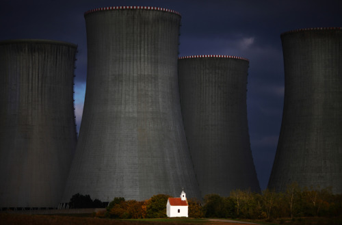 evilbuildingsblog:A nuclear power plant built in a beautiful wheat field near a chapel. (Czech Republic) 