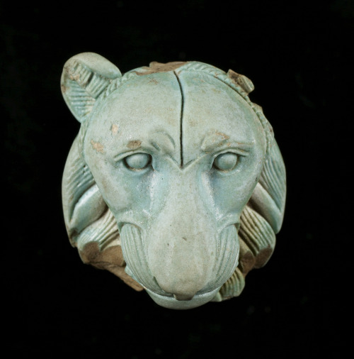 Ancient Egyptian appliqué (faience with light blue glaze) in the shape of a lion’s head