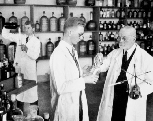 Archival photo of Jacques Guerlain (right) in his laboratory.