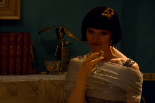 Miss Phryne Fisher and Inspector Jack Robinson, making eye contact. (King Memses’ Curse.)