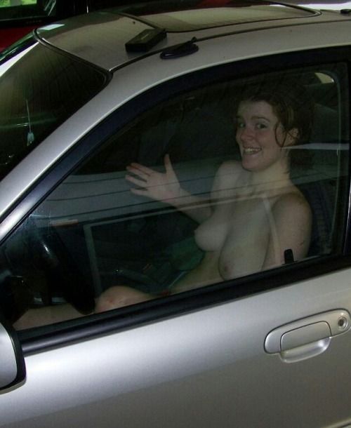 carelessinpublic:  Showing her boobs and posing almost topless inside a car