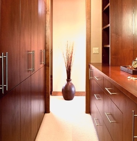 Closet - Walk-InHuge, Contemporary, Gender-neutral Walk-in Closet Design With A Beige Floor And Cabinets