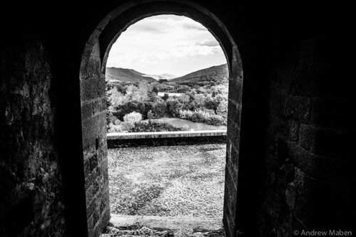 An open doorway, a distant glimpse…Santa Pau, Zona Volcànica de la Garrotxa, Catalunya