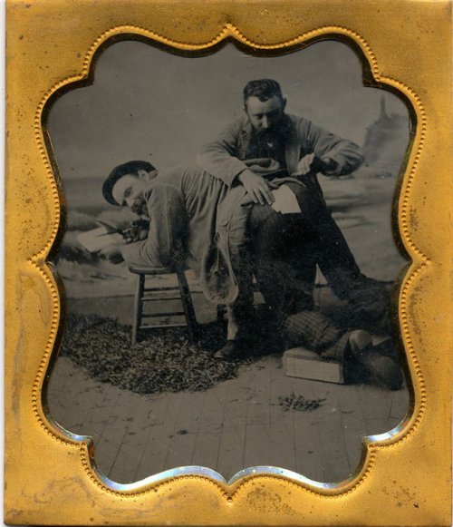 Sewing his trousers 1/6 plate tintype in full case.