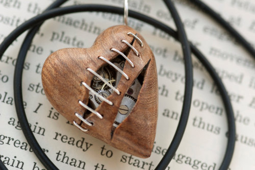 wickedclothes:  Stitched Clockwork Heart Pendants Sometimes our hearts get ripped apart at the seams. Luckily, time heals all wounds. Carved out of various woods, these heart pendants are filled with old watch parts. Sold on Etsy. 