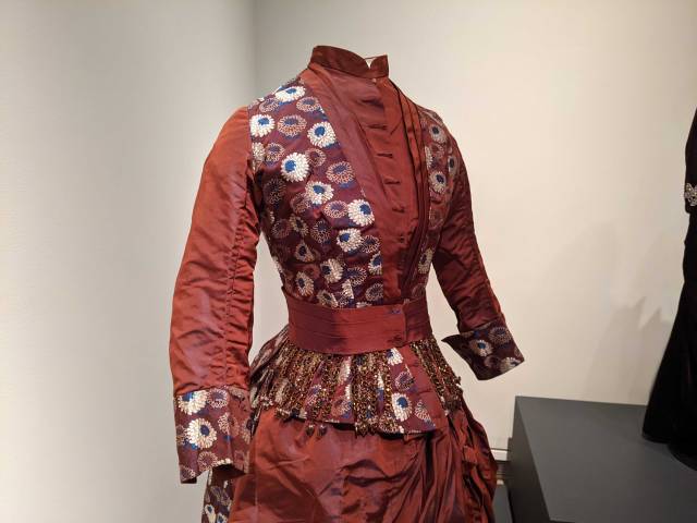 Image of an 1880s gown in a museum collection that is clearly the source for the design of Cynthia Nixon's costume.