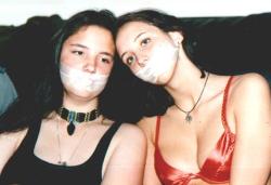 kiltedpatriot:  Two home-invaded young girls, gagged with semi-transparent medical tape, awaiting their “turn” with their lucky captor. Heh heh! ;)