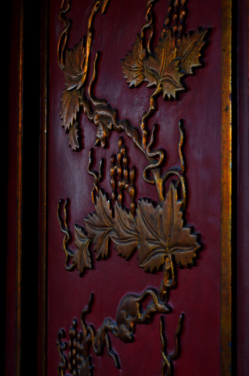 Carved relief of vines on a door at Quan Thanh Temple established during the reign of Emperor Lý Thá