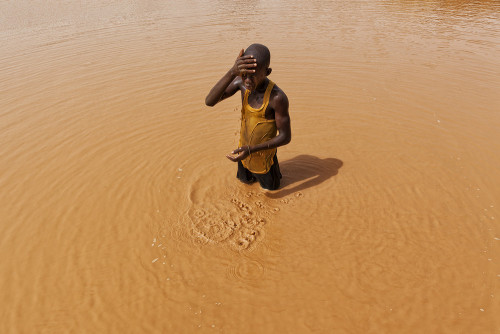 riggu:  Digging the Future by Matjaz Krivic“Yakuba (16) emerges from a 50m deep hole after another gruelling 14-hours work day underneath the panorama of western Burkino Faso. Last year his uncle and two of his friends died when a mine near by collapsed.